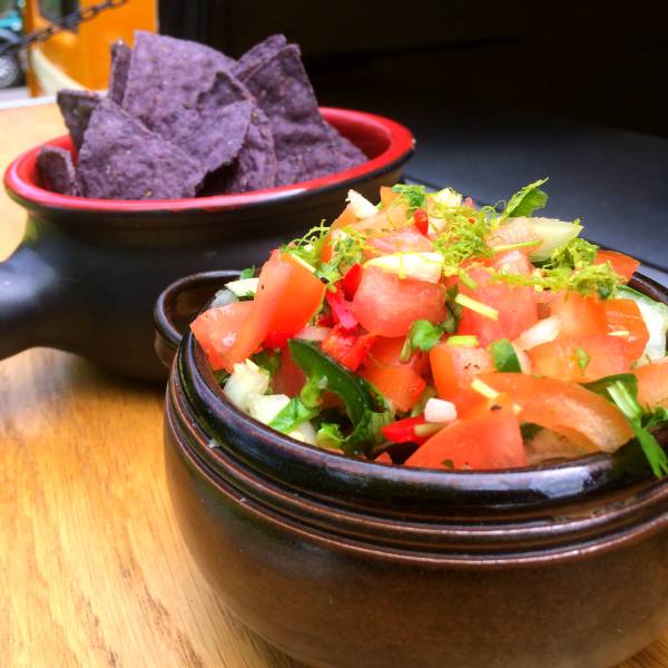 Pico de gallo and blue tortilla chips